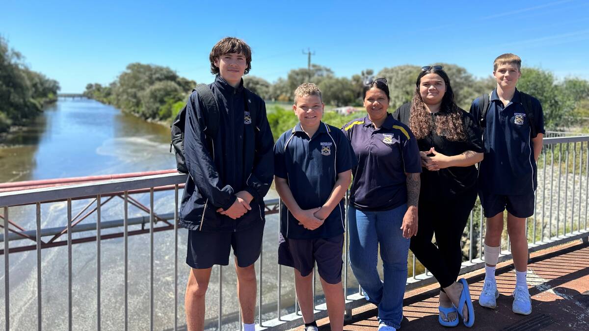 Students from Busselton High Schools Waalitj Kaaditjin Academy Darcy Anderson, Dailen Sanderson and Jai Spinks with their teacher Gwendoline Gray and artist Mariah Yarran.